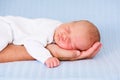 Newborn baby boy sleeping on the hand of his father Royalty Free Stock Photo