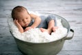 Newborn baby boy, sleeping peacefully in basket, dressed in knit Royalty Free Stock Photo