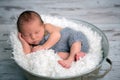 Newborn baby boy, sleeping peacefully in basket, dressed in knit Royalty Free Stock Photo