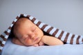 Newborn Baby Boy Sleeping Peacefully Under Striped Blanket Royalty Free Stock Photo