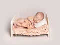 Newborn baby boy sleeping on a small bed Royalty Free Stock Photo