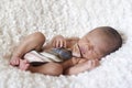 Newborn baby boy sleeping with a tie Royalty Free Stock Photo