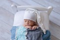 Newborn Baby Boy Sleeping on a Tiny Bed Royalty Free Stock Photo