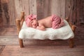 Newborn Baby Boy Sleeping on a Tiny Bed Royalty Free Stock Photo