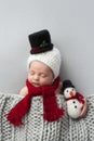 Newborn Baby Boy with Snowman Hat and Plush Toy