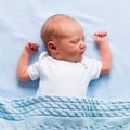 Newborn baby boy under a blue blanket Royalty Free Stock Photo