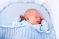 Newborn baby boy in white bassinet Royalty Free Stock Photo