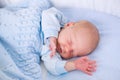 Newborn baby boy in white bassinet Royalty Free Stock Photo