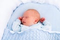 Newborn baby boy in white bassinet Royalty Free Stock Photo