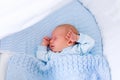 Newborn baby boy in white bassinet Royalty Free Stock Photo