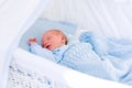 Newborn baby boy in white bassinet Royalty Free Stock Photo