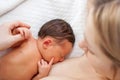 Newborn baby breastfeeding after birth. Royalty Free Stock Photo