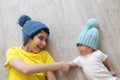 Newborn baby with brother. Brothers in hats. Winter time. Friends. love and friendship.