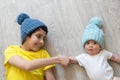 Newborn baby with brother. Brothers in hats. Winter time. Friends. love and friendship.