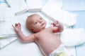 Newborn baby on changing table with diapers Royalty Free Stock Photo