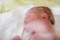 Newborn baby child seconds and minutes after birth lying on towel Royalty Free Stock Photo