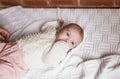 a newborn baby in a crib, the concept of children and the birth of a close-up Royalty Free Stock Photo