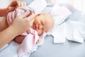 Newborn baby in a diaper on the changing table