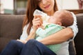 Newborn baby drinking milk from a bottle Royalty Free Stock Photo