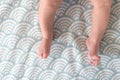 Newborn baby feet, barefoot with tiny toes in selective focus, family and maternity concept. Photo of newborn baby feet.