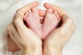 Newborn baby, feet in father hand Royalty Free Stock Photo