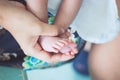 Newborn baby feet on mother hand Royalty Free Stock Photo