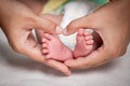 Newborn baby feet in mother hands Royalty Free Stock Photo