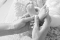 Newborn baby feet in mother hands, shape like a lovely heart. Mother holding legs of the kid in hands. Close up image. Happy Royalty Free Stock Photo