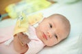 A newborn baby on the first day of its birth in the maternity hospital Royalty Free Stock Photo