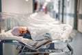 Newborn baby in first of many small hospital beds