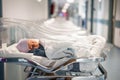 Newborn baby in first of many small hospital beds Royalty Free Stock Photo