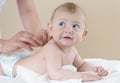 Newborn Baby getting oil massage Royalty Free Stock Photo