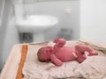 A newborn baby girl cries moments after birth Royalty Free Stock Photo