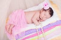 Newborn baby girl in a crown sleeping on the bed of mattresses. Fairy Princess and the Pea Royalty Free Stock Photo