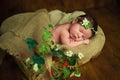 Newborn baby girl has sweet dreams in strawberries Royalty Free Stock Photo