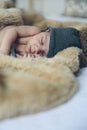 Baby girl with pompom hat sleeping Royalty Free Stock Photo