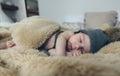 Baby girl with pompom hat sleeping Royalty Free Stock Photo