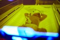 Newborn baby girl receiving phototherapy for jaundice Royalty Free Stock Photo