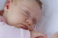 Newborn baby girl sleeping in a cradle outdoors Royalty Free Stock Photo