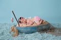 Newborn Baby Girl Sleeping in a Fishing Boat Royalty Free Stock Photo