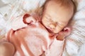 Newborn baby girl sleeping in her crib Royalty Free Stock Photo