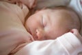 Newborn baby girl sleeping in her crib Royalty Free Stock Photo