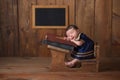 Newborn Baby Girl Sleeping at her School Desk Royalty Free Stock Photo