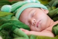 Newborn baby girl smiling in a dream ,Newborn baby girl is sleep Royalty Free Stock Photo