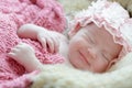 Newborn baby girl smiling in a dream ,Newborn baby girl is sleep Royalty Free Stock Photo
