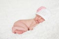 Newborn Baby Girl Wearing a Crocheted Hat