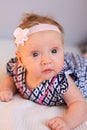 Newborn Baby girl wearing fancy dress and hair bow Royalty Free Stock Photo