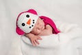 Newborn Baby Girl Wearing a Pink Snowgirl Costume Royalty Free Stock Photo