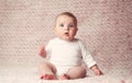 Newborn baby girl with white bodysuit