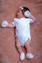 Newborn baby girl wearing a tiny bow headband Royalty Free Stock Photo